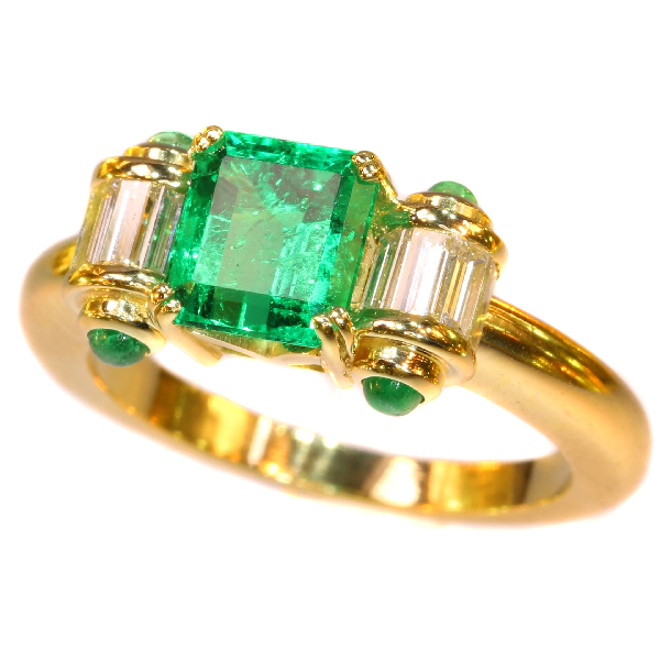Estate engagement ring with top emerald and diamonds
